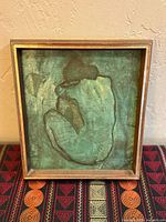 Front view of framed Picasso-style nude artwork