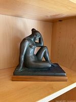 Full view of sculpture on shelf