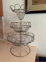 Front view of entire three-tier wire fruit basket
