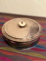 Top view of lidded hammered silver pot