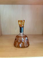 Full view of amber cut-to-clear carafe with stopper