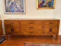 Front view of full sideboard showing drawer and cabinet configuration