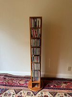 Full view of wooden CD tower stand with CDs