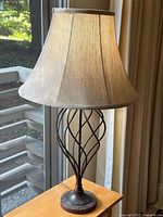 Full view of table lamp and shade on side table