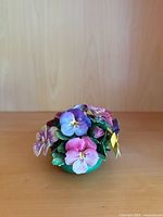 Front view of porcelain pansy sculpture