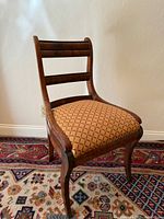 Full view of wooden Regency style chair