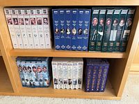 Entire lot showing two shelves of VHS box sets