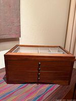 Front view showing wood finish and drawer pulls