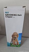 Front of retail box displaying product name and puppy image