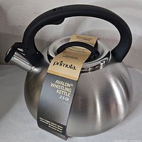 Primula Avalon whistling kettle showing full body, handle, spout, and attached tag