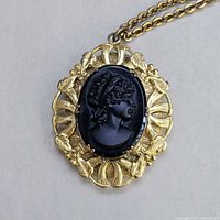 Front view close-up of cameo locket pendant