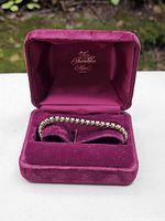 Bracelet displayed inside open Franklin Mint velvet box