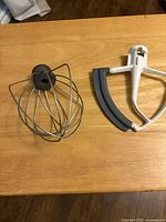 Wire whisk and flex edge beater paddle on tabletop