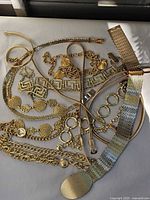 Overview of all gold-tone belts laid out
