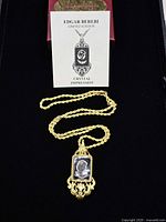 Necklace laid out in box with info card visible