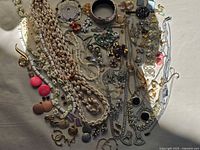 Full spread of assorted vintage jewelry
