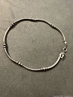 Full view of sterling silver bracelet laid flat