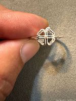 Close-up of ring front showing openwork four-leaf clover design