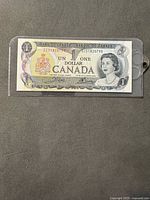 Obverse of the $1 banknote in sleeve