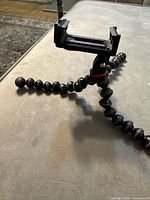 Side view showing flexible legs and phone mount