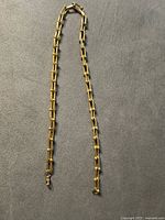 Full view of gold-tone rectangular link necklace