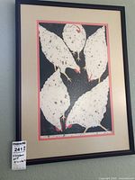 Full view of framed print under glass