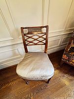 Front view of chair showing cushion and wood frame