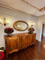 Front view of carved solid wood hutch under mirror
