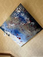 Full view of the square abstract painting mounted on wall