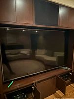 Front view of Sony Bravia television within cabinet