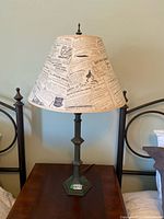 Full view of lamp on table showing shade and base