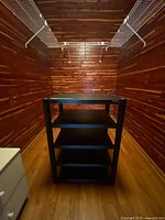 Front view of black 5-shelf audio rack