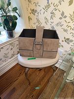 Stool with magazine basket placed on top