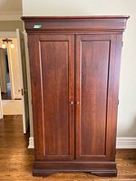 front view of dark wood wardrobe with two doors