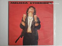 Front jacket showing album art and sealed sleeve