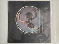 Front cover of Shirley Bassey Love, Life and Feelings LP in clear sleeve