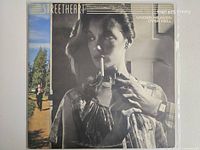 Front album cover in plastic sleeve