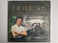 Front cover of Volume 1 showing Julio Iglesias at fountain