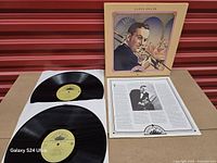 Both vinyl discs, inner sleeve with notes, and front cover displayed