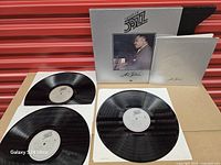 All three discs, slipcase and booklet laid out