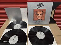 Overview of three LPs, booklet and outer box