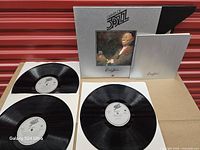 Box set with three vinyl records and booklet laid out