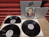 Box front, three records, sleeves visible