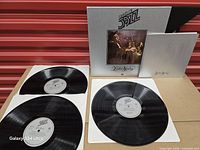 Full set with three LPs, booklet and slipcase