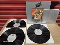 Overview of three records, slip-case box and booklet