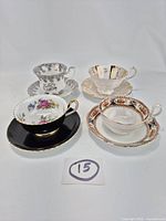 Group shot of four teacup and saucer sets