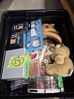 Overview of entire lot inside black plastic bin