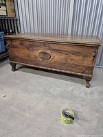 Front view of cedar chest showing overall form and veneer