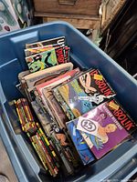 Blue bin filled with numerous Italian digest comics