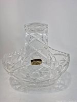 Front view of handled basket showing Violetta cut pattern and Polonia label